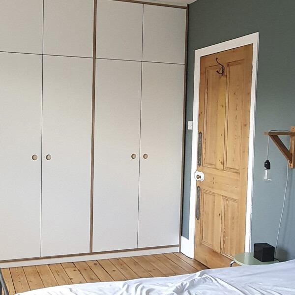 full height white plywood wardrobe