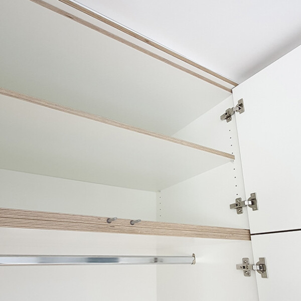 white plywood wardrobe shelving